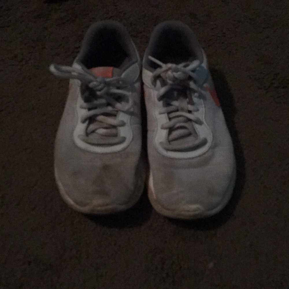 Grey and orange Nike shoes
